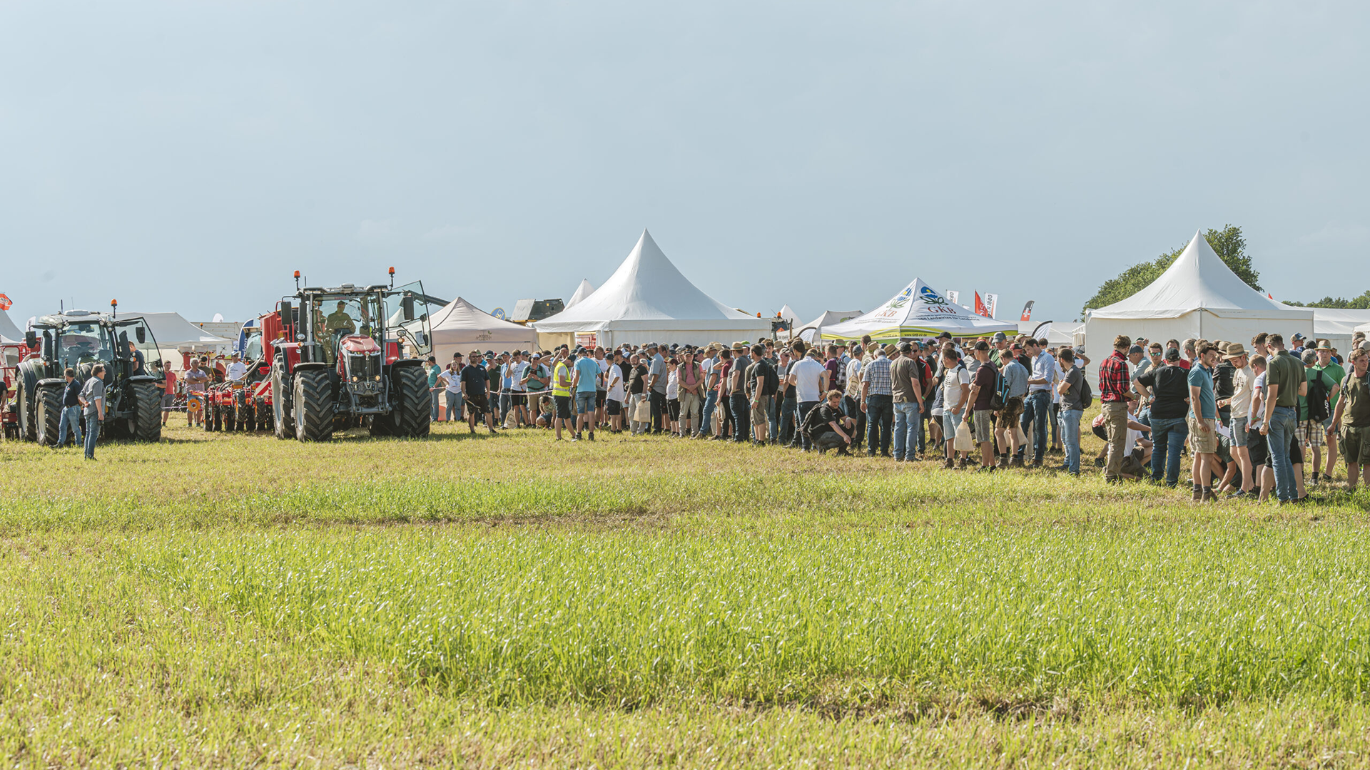 The festival grounds, featuring tents and tractors on display